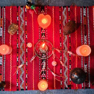 Candles and objects in circle on altar