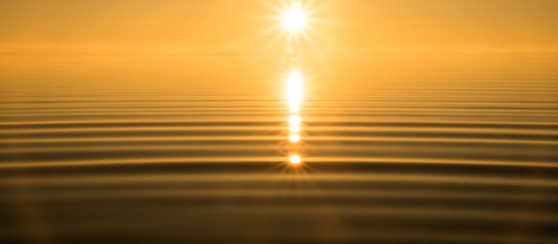 Sun on calm lake