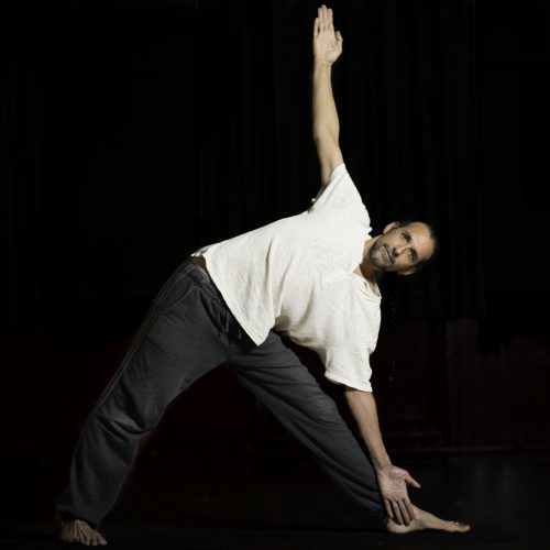 Man standing in Triangle pose